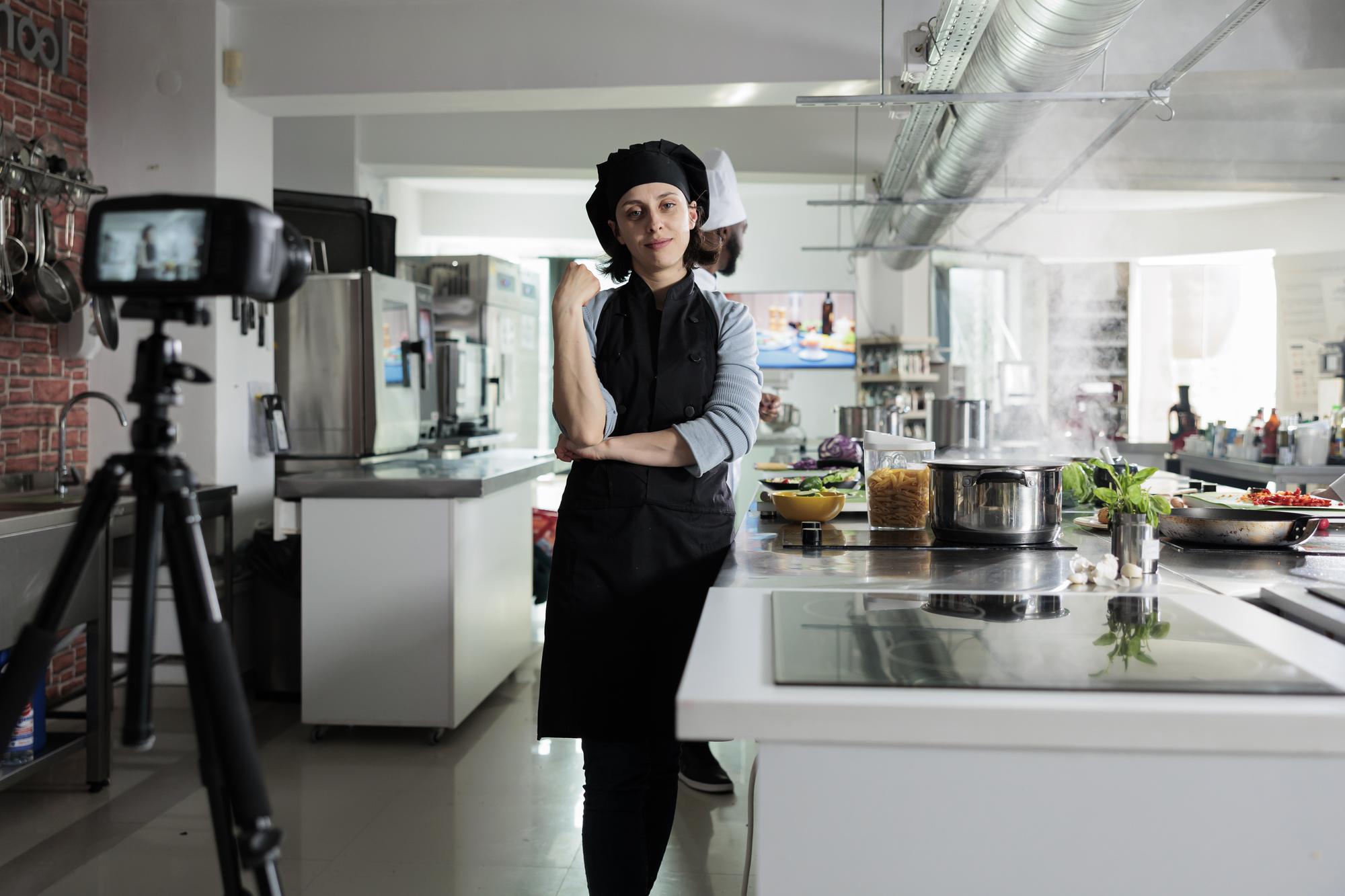 Instructor speaking in front of camera in studio kitchen